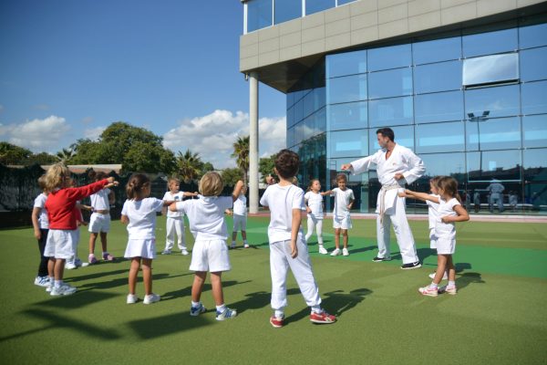 circle-of-kids-punching-scaled-600×400-1